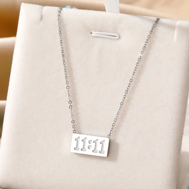 11:11 silver necklace with rectangular pendant and chain, ideal for manifestation and minimalist style.