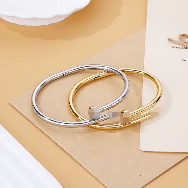 A polished rose gold nailhead anti tarnish stainless steel waterproof cuff bracelet