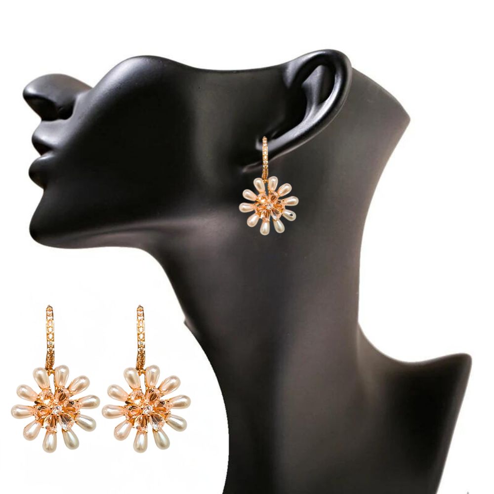 Gold-plated daisy drop earrings with pearl petals and crystal centers, perfect for weddings, brunches, or stylish everyday looks.