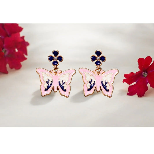 Close-up of pink butterfly earrings with navy blue accents, featuring delicate enamel details and navy flower studs