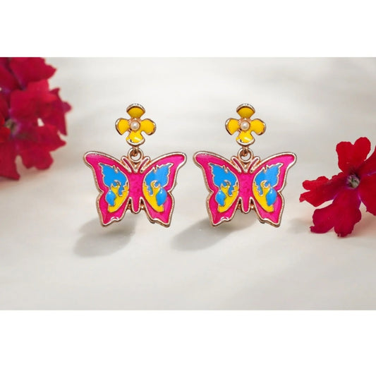 Close-up of colorful butterfly earrings featuring pink, blue, and yellow enamel, accented with yellow flower studs.