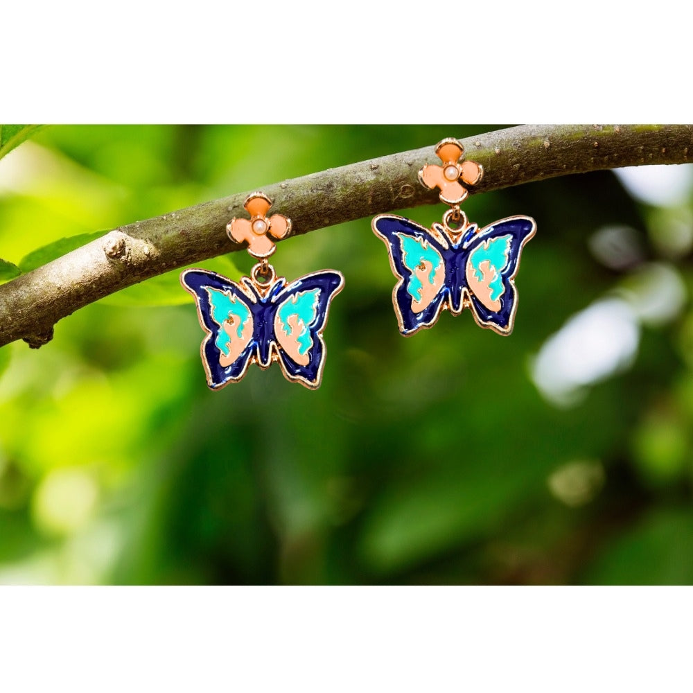 Iridescent blue butterfly earrings with gold accents and peach floral studs