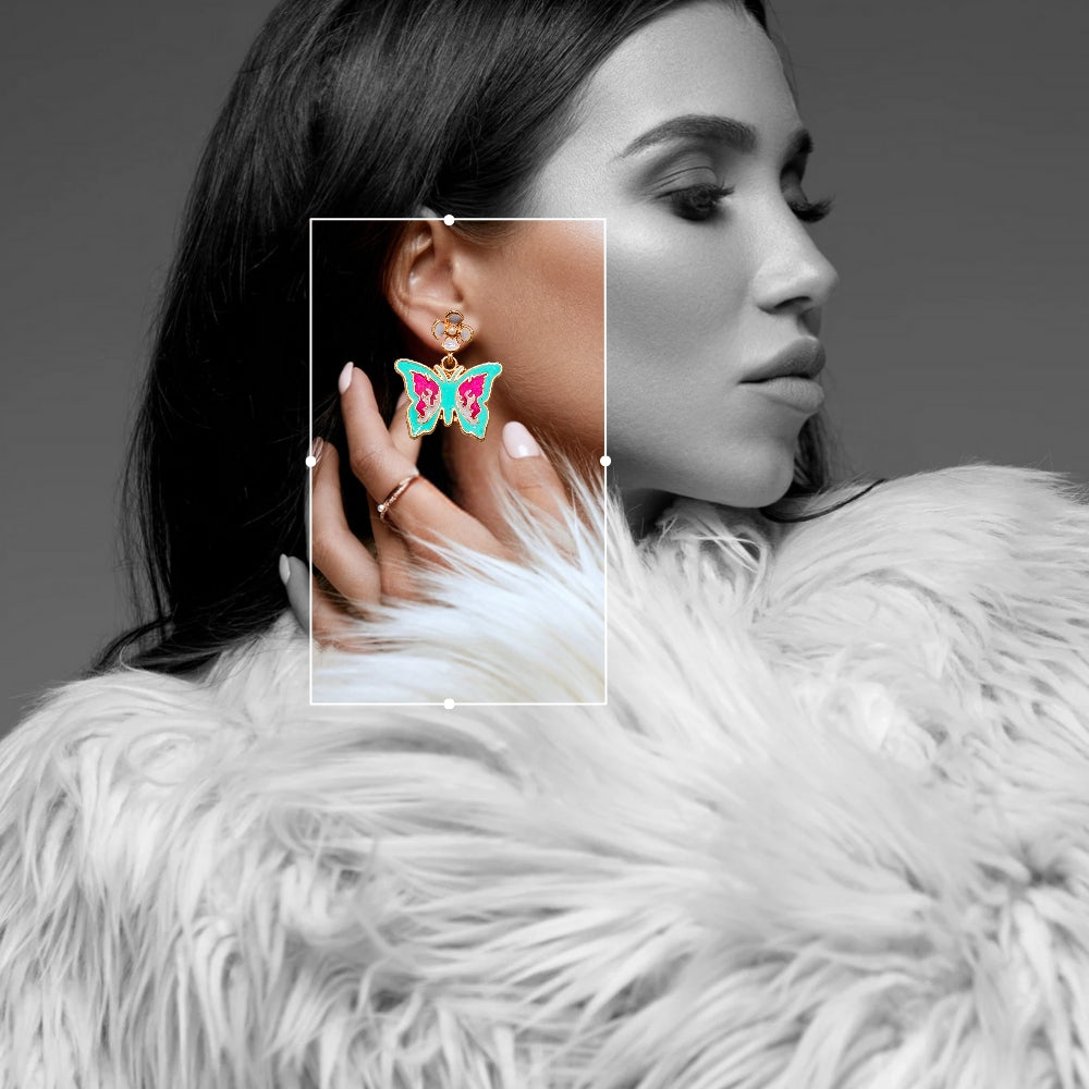 Colorful butterfly dangle earrings with turquoise and magenta enamel accents, paired with delicate gold-tone floral studs.